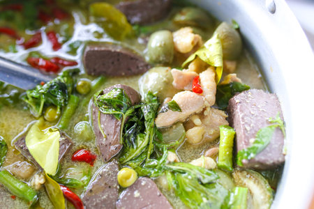 Thai green curry with pork and kale in pot, Thai foodの写真素材