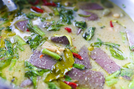 Thai food - Spicy green curry with pork and herb.の写真素材