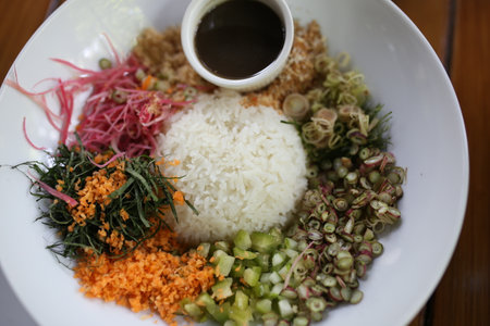 Thai Southern Spicy Rice Salad with Vegetables, Budu Thai southern styled fish sauce.の写真素材
