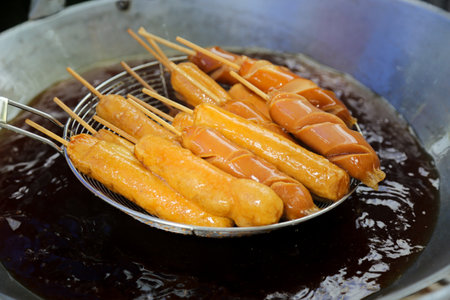 Fried sausage in hot pan at street food market, Thailand. pork ball.の写真素材