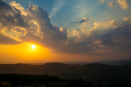 Sunset in the mountains, beautiful sky with clouds, nature backgroundの写真素材