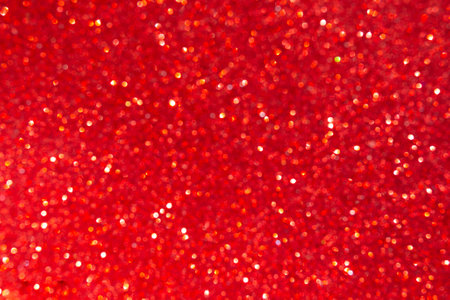 Red glitter christmas abstract background. Blurred bokeh lights.の写真素材