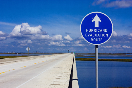 Hurricane evacuation route sign on an elevated highway above the coastal marshの写真素材