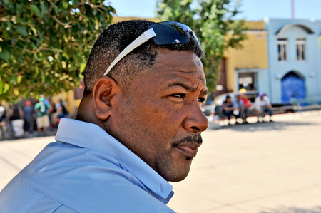 TRINIDAD, CUBA, OCTOBER 27, 2009  A man with sunglasses on his forehead in the central plaza of Trinidad, Cuba, on October 27th, 2009 のeditorial素材