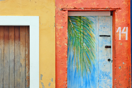 OLINDA, RECIFE, BRAZIL, SEPTEMBER 1, 2009  Beautiful colourful houses in Olinda, Recife, Brazil, on September 1st, 2009  A palm leave painted on a door のeditorial素材