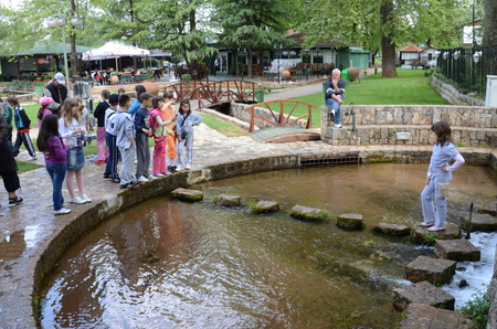 BITOLA, MACEDONIA, MAY 19, 2011  Children at the age of seven or eight playing around a water pond in an amusement park in Bitola, Macedonia, on May 19th, 2011 のeditorial素材