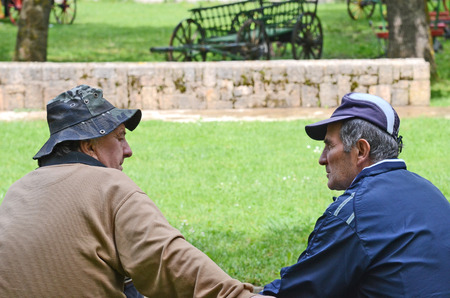 BITOLA, MACEDONIA, MAY 19, 2011  Old men sitting on a park bench in Bitola, Macedonia, on May 19th, 2011 のeditorial素材