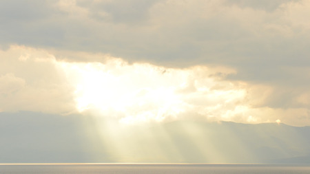 Sun setting down behind lake in Ohrid, Macedonia, on May 18th, 2011 
