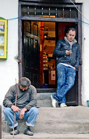 BRAJCINO, MACEDONIA, MAY 18, 2011  Men sitting on the porch of a pub in the first eco village in Macedonia, in Brajcino, Macedonia, on May 18th, 2011 のeditorial素材
