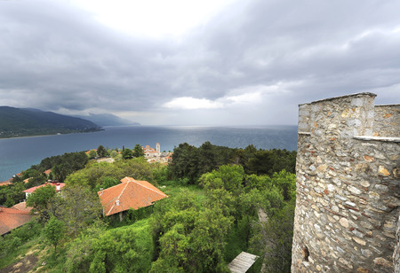 OHRID, MACEDONIA, MAY 18, 2011  A from the fortress of Tsar Samuil with a tower in the front, and the church of Sveti Jovan Bogoslov Kaneo in the horizon, in Ohrid, Macedonia, on May 18th, 2011 のeditorial素材