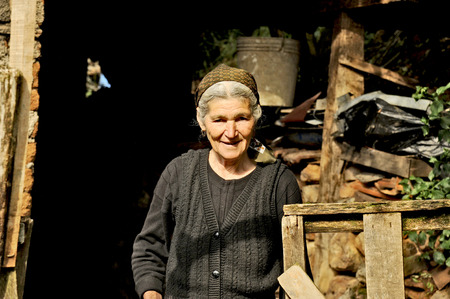 OHRID, MACEDONIA, MAY 17, 2011  An old Macedonian lady in a black dress in the countryside of Ohrid, Macedonia, on May 17th, 2011のeditorial素材