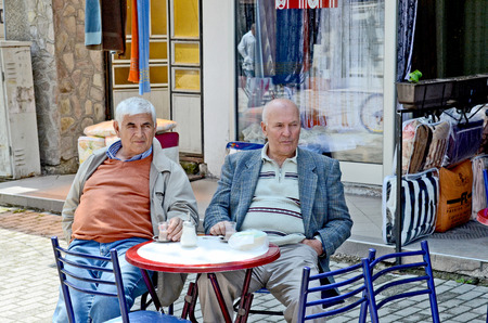 OHRID, MACEDONIA, MAY 17, 2011  Two middle aged men on a terrace of a restaurant in Ohrid, Macedonia, on May 17th, 2011 のeditorial素材