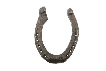 iron horseshoe with holes against white background の写真素材