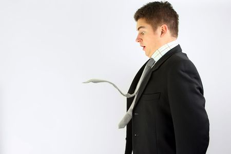 young businessman over with with crazy tieの写真素材