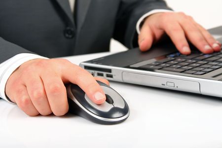 businessman is working or operating computer and mouseの写真素材