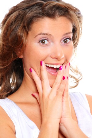 A portrait of a young beautiful happy woman smiling over white backgroundの写真素材