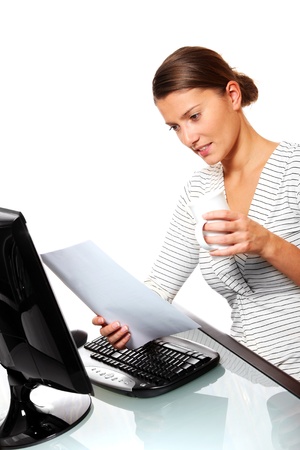 A portrait of a young woman being busy in her officeの写真素材