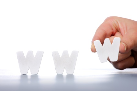 A picture of female hand creating a word www over white backgroundの写真素材