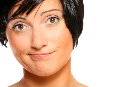 A picture of a young dissatisfied woman over white backgroundの写真素材