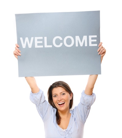 A portrait of a young happy woman holding a banner over white backgroundの写真素材