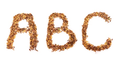 Three first letters of alphabet created with leaves over white backgroundの写真素材