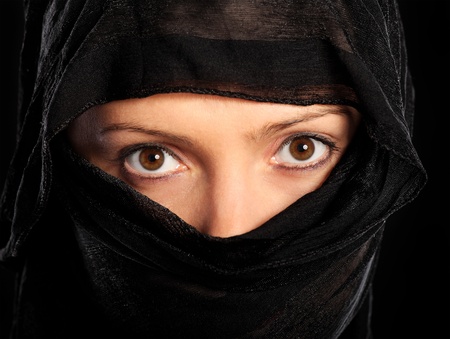 A picture of a young muslim woman over black backgroundの写真素材