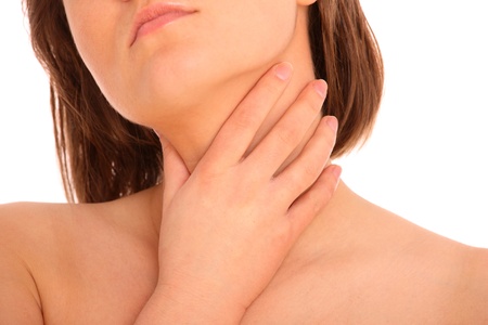A picture of a young woman suffering from tonsillities over white background