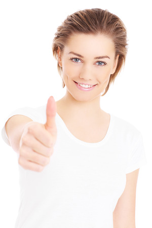 A picture of a happy woman showing ok sign over white backgroundの写真素材