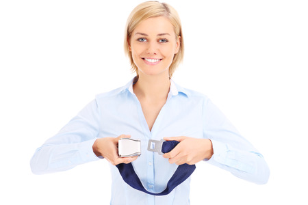 Blonde stewardess in blue shirt showing belt over whiteの写真素材
