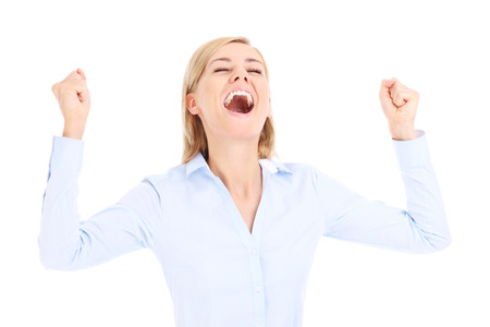 Happy business woman with hands up over white backgroundの写真素材