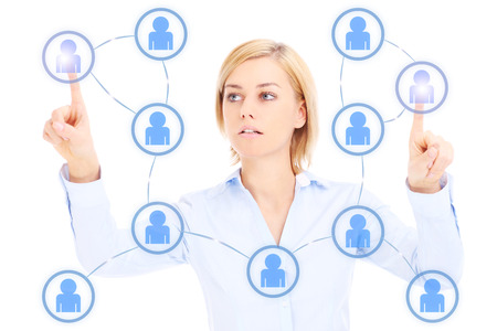 Young businesswoman and social network over white backgroundの写真素材