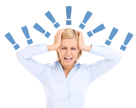 A picture of a tired and stresses businesswoman shouting over white backgroundの写真素材