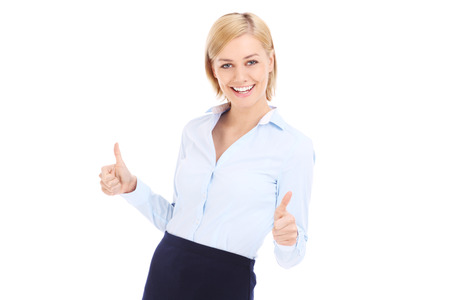 A picture of a happy businesswoman showing ok signs over white の写真素材