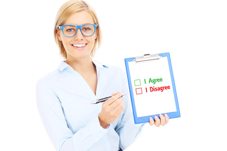 A picture of a young businesswoman with documents making decision over white backgroundの写真素材