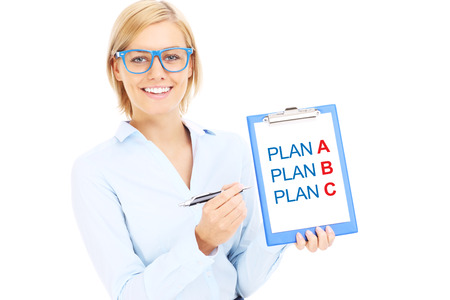 A picture of a young businesswoman with plan A and plan B over white backgroundの写真素材