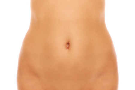 A picture of a female belly over white backgroundの写真素材