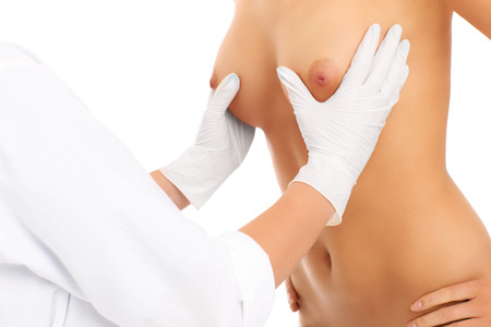 A picture of a doctor examining breast over white backgroundの写真素材