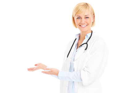 A picture of a young doctor with stethoscope welcoming you over white backgroundの写真素材