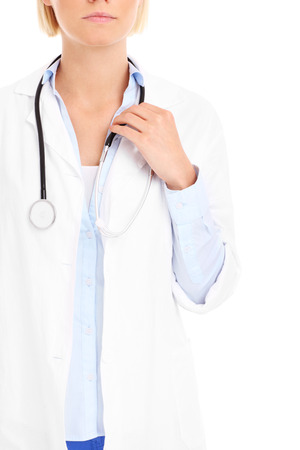 A midsection of a doctor with stethoscope over white backgroundの写真素材