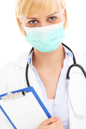 A picture of a doctor in mask with documents over white backgroundの写真素材