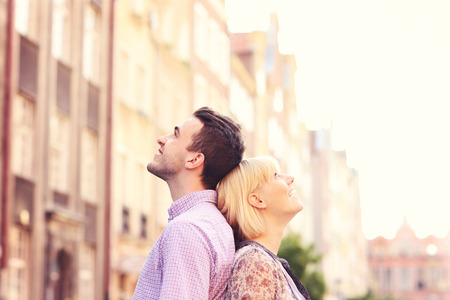 A picture of a happy couple admiring architecture in the Old Town of Gdansk in Polandの写真素材