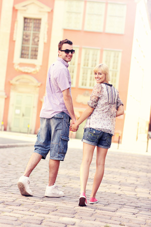 A picture of a happy couple strolling about the cityの写真素材
