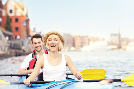 A picture of a young couple in a canoeの写真素材