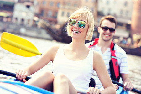 A picture of a young couple in a canoe sigtseeing Gdansk in Polandの写真素材