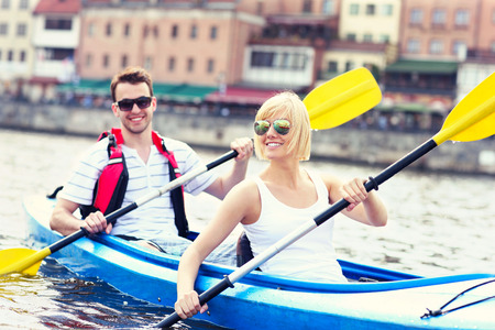 A picture of a young couple in a canoe sigtseeing Gdansk in Polandの写真素材
