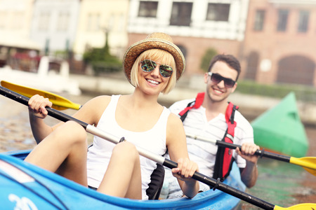 A picture of a young couple in a canoeの写真素材