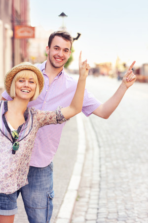 A picture of tourists hailing a taxi in Gdansk の写真素材