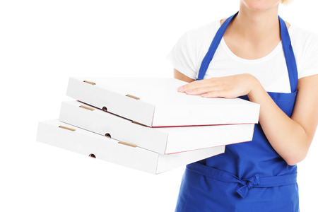 A midsection of a woman with pizza boxes over white backgroundの写真素材