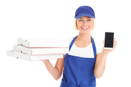 A picture of a happy woman with pizza boxes and cellphone over white backgroundの写真素材