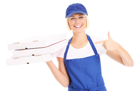 A picture of a happy woman with pizza boxes over white backgroundの写真素材